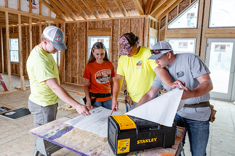 Photo of ONU Students working at a construction site