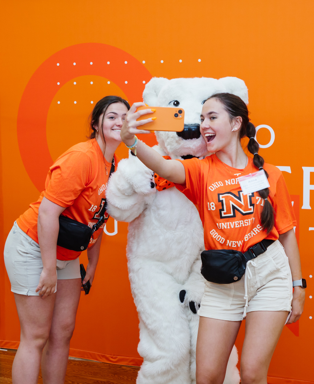 students taking a photo with school mascot Klondike