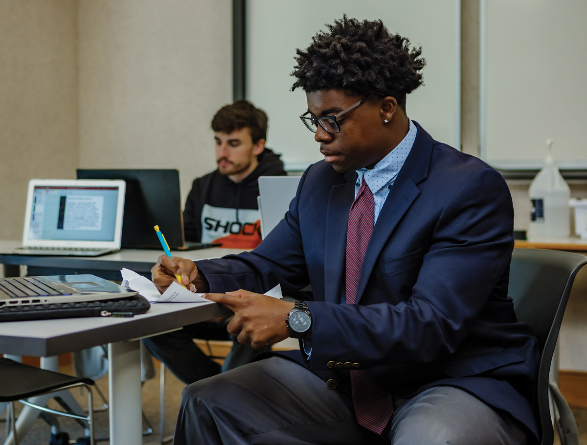 Photo of an ONU student in a suit and tie