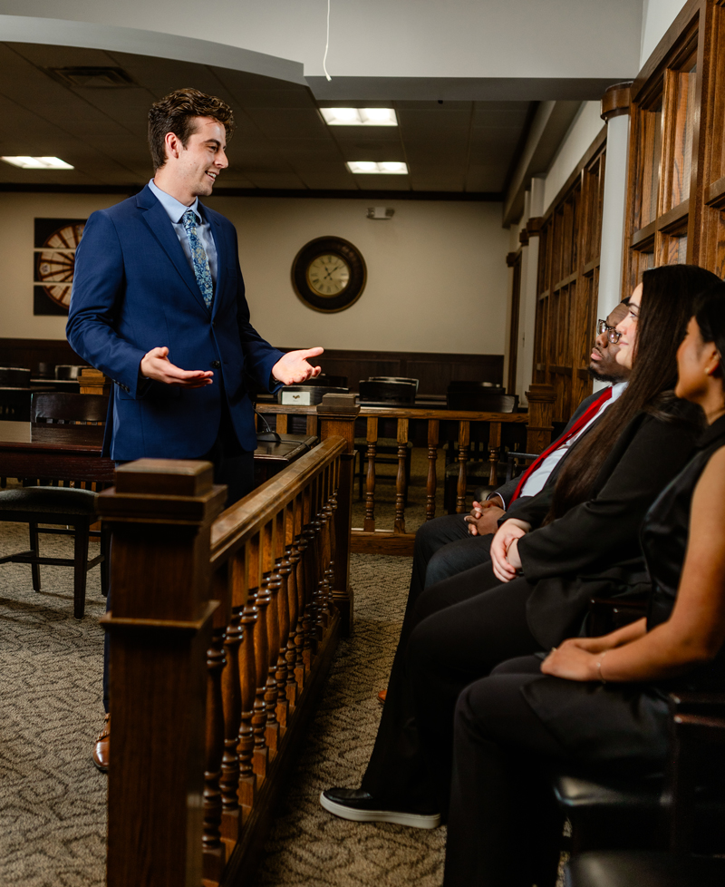 Law student presenting his case during a mock trial