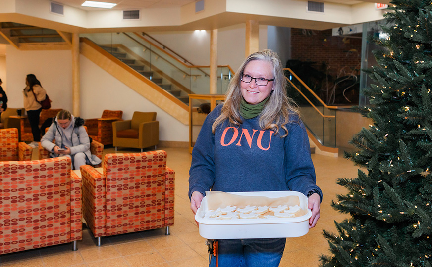 Photo of Katherine with her polar bear cut out cookies