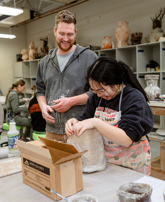 Photo of Art and Design class, ONU students around a fresh new clay