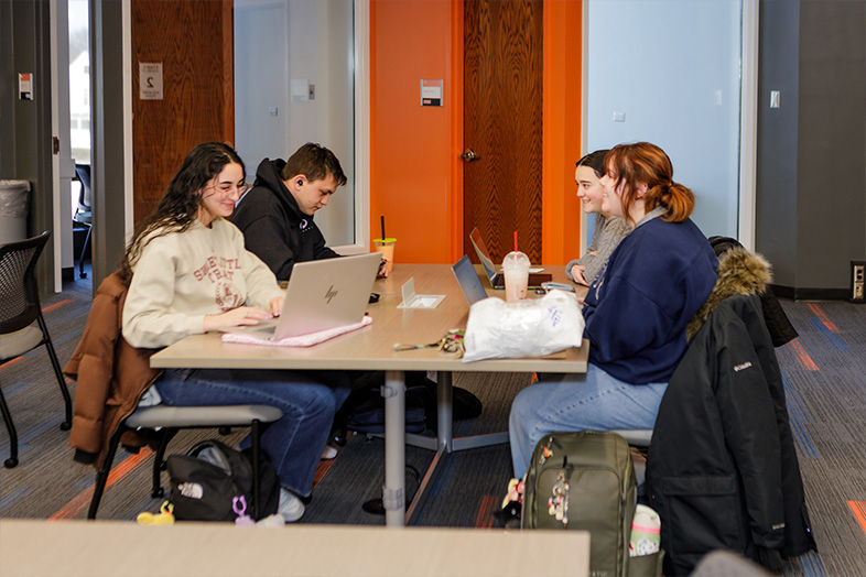 Photo of ONU students sitting at a table