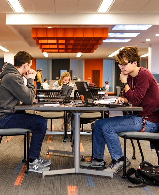 Photo of ONU students sitting at a table together