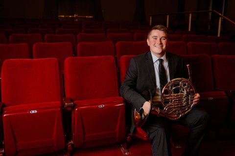 Photo of Gavin with his French Horn