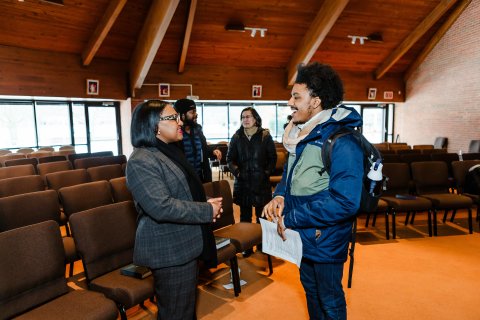 Photo of Mayor Sharetta Smith speaking to a student