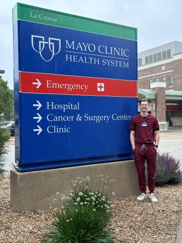 Photo of Griffin in front of Mayo Clinic Signage