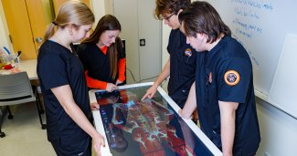 Photo of ONU nursing students using Anatomage Table