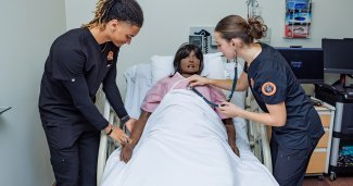 Photo of ONU Nursing students working on a patient dummy