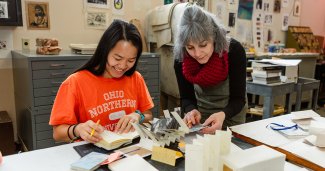 Photo of ONU student and faculty working on a project