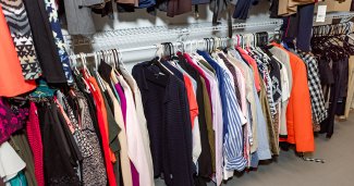 Photo of ONU's career closet, which shows many business clothes on racks