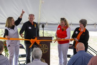 Photo of softball ribbon cutting