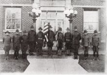 Historical Photos from WW1, photo of military men standing in front of a brick building